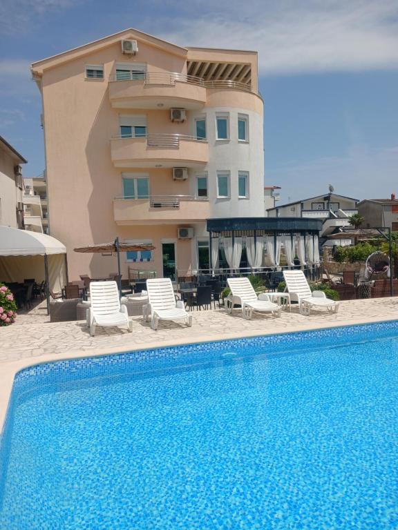Portrait view of the guest house beside the pool