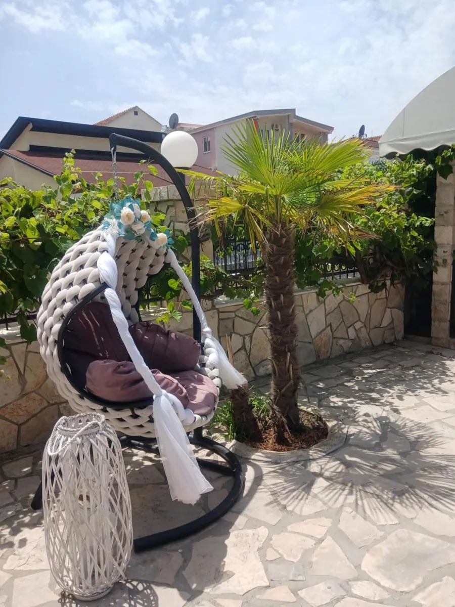 Garden swing in a shaded corner