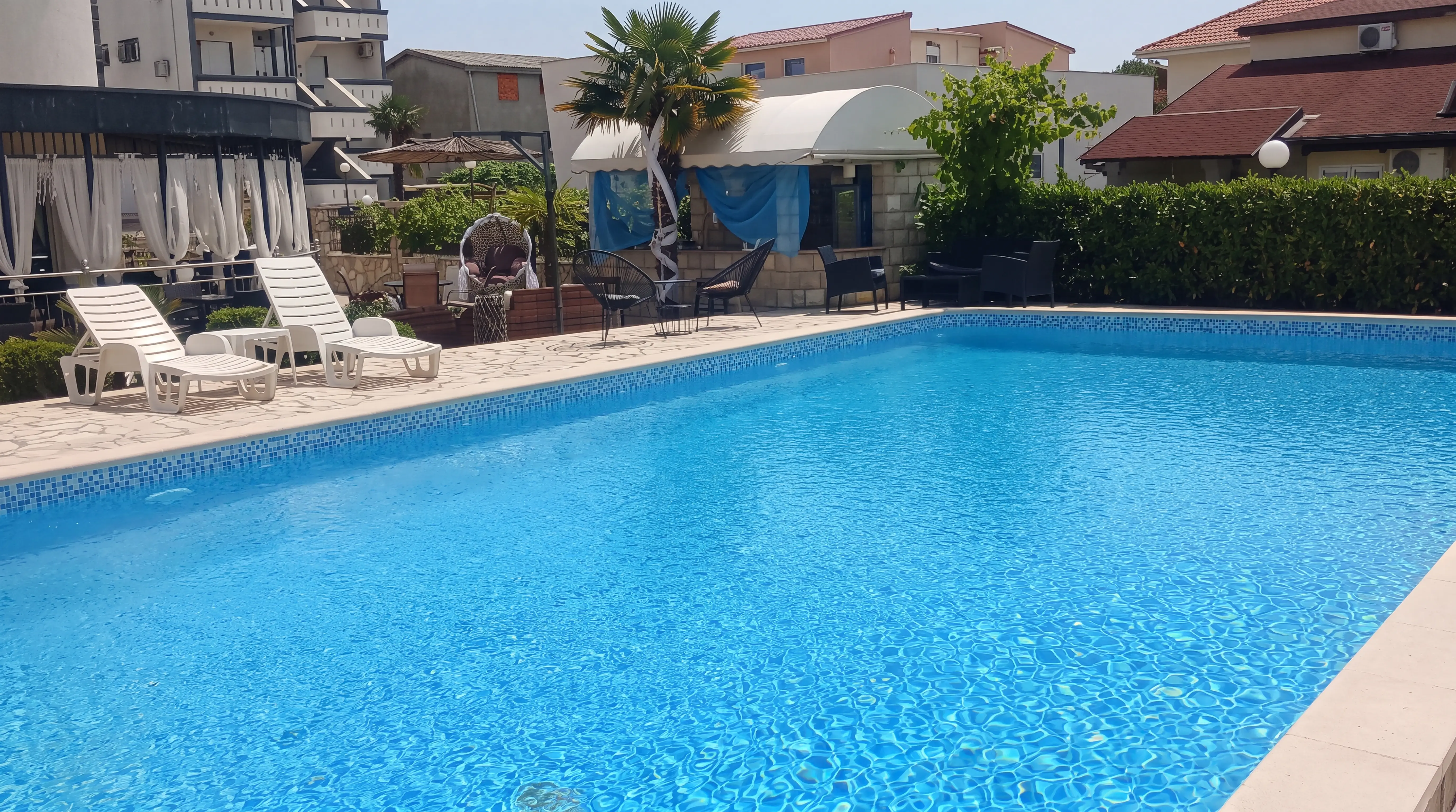 Panoramic view of the outdoor pool at Guest House Denis