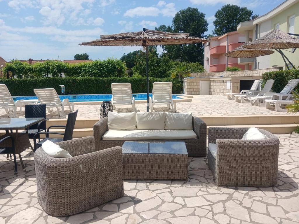 Outdoor lounge seating beside the pool
