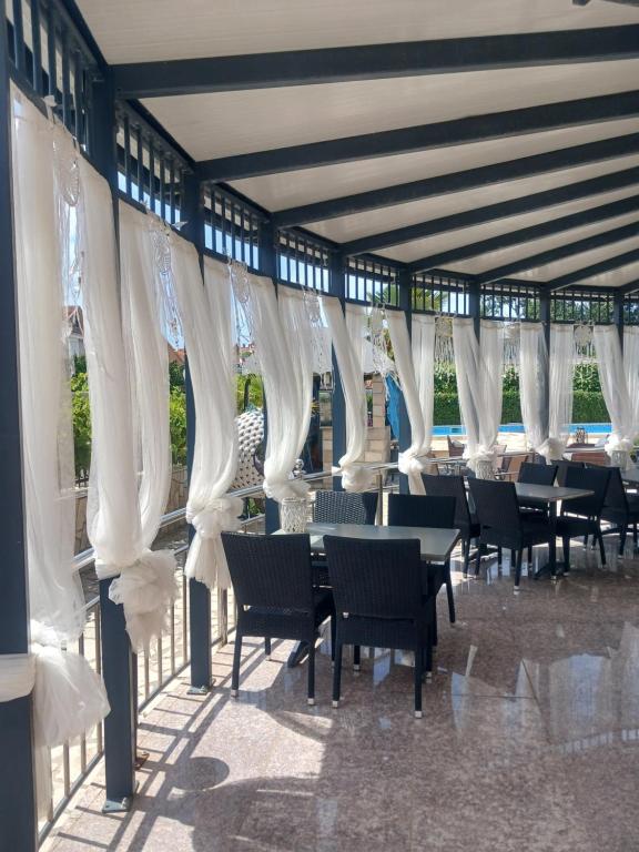 Restaurant terrace with white curtains