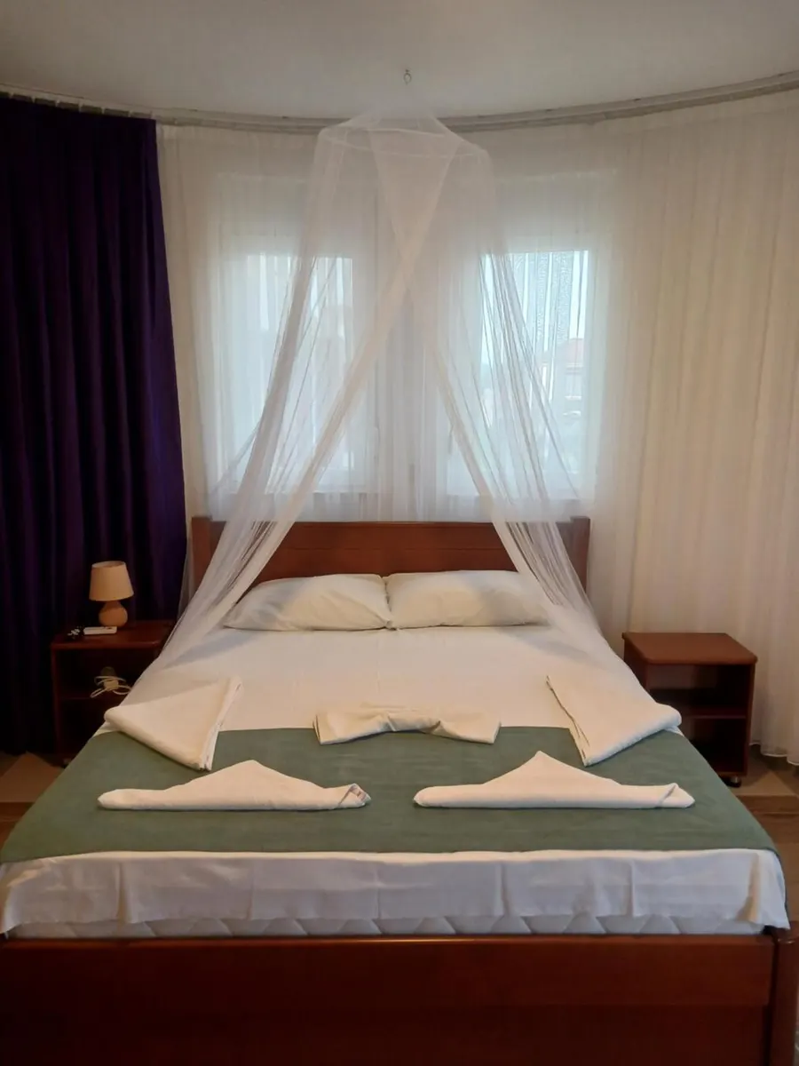 Guest room with a canopy above the bed