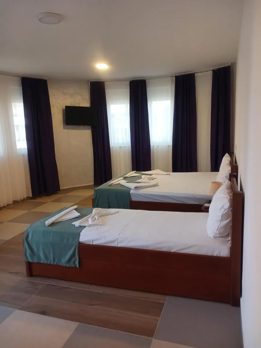 Bright guest room with two separate beds